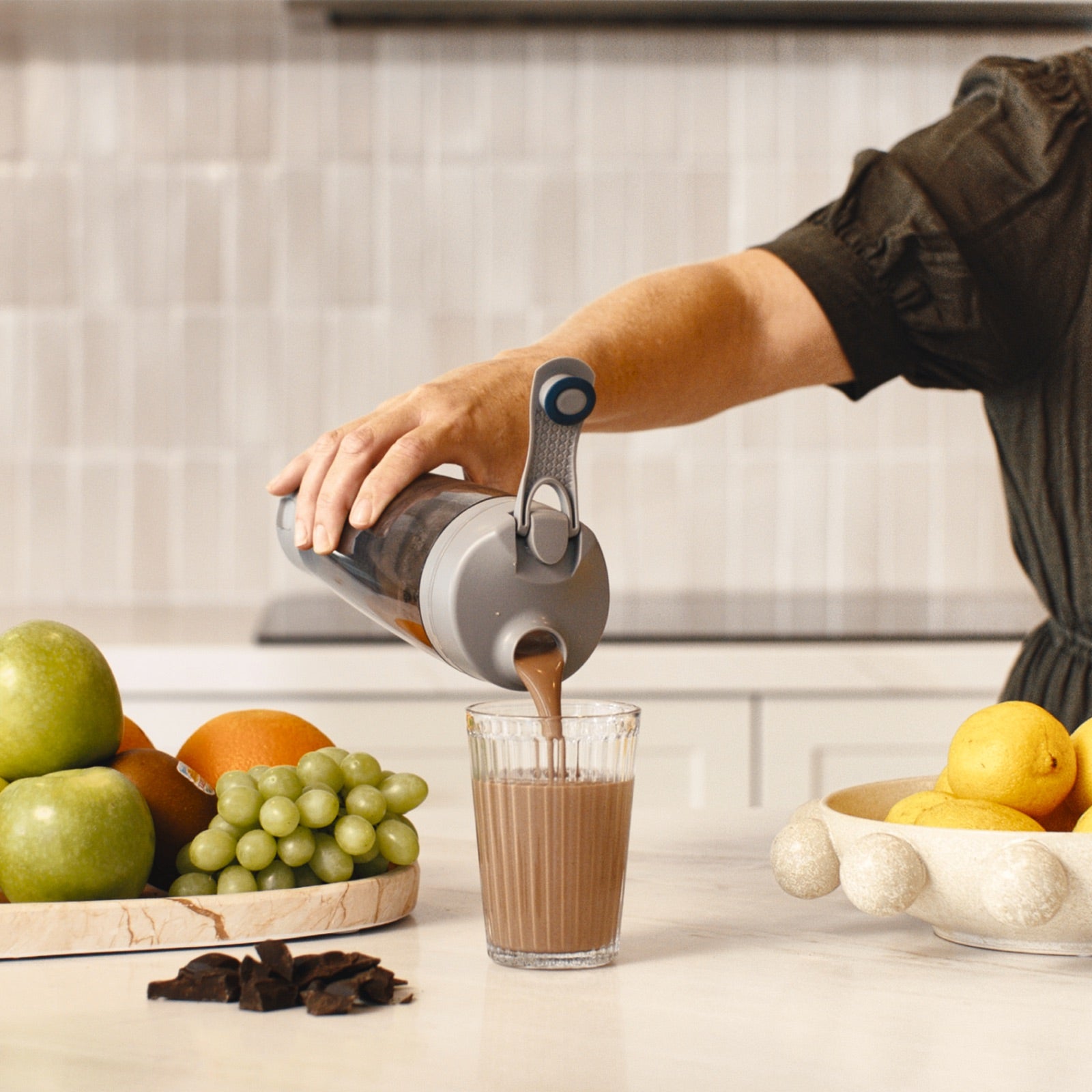 HLTH+ daily nutritional shake being poured